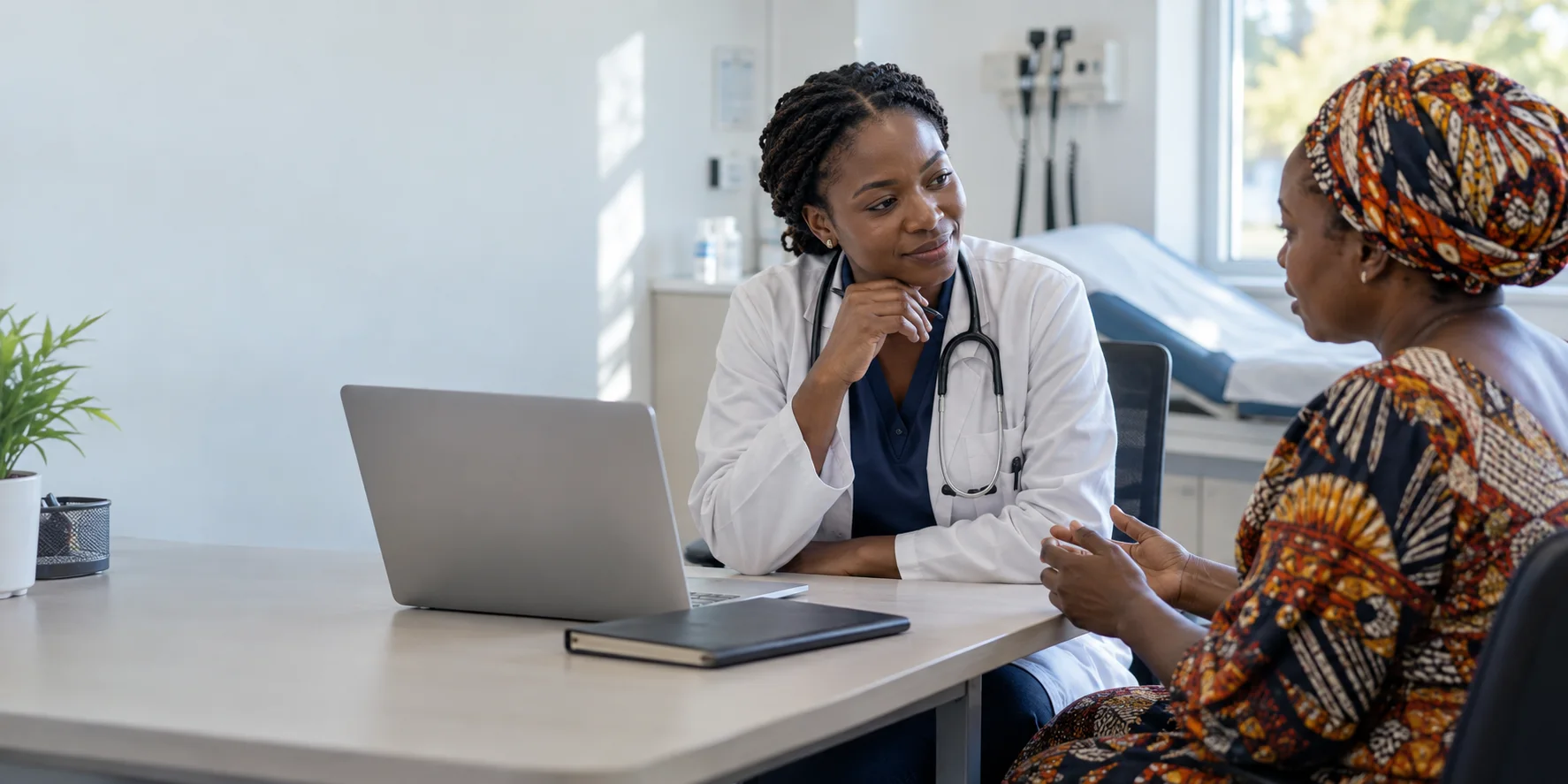 Clinician listening attentively to a patient during a hospital consultation