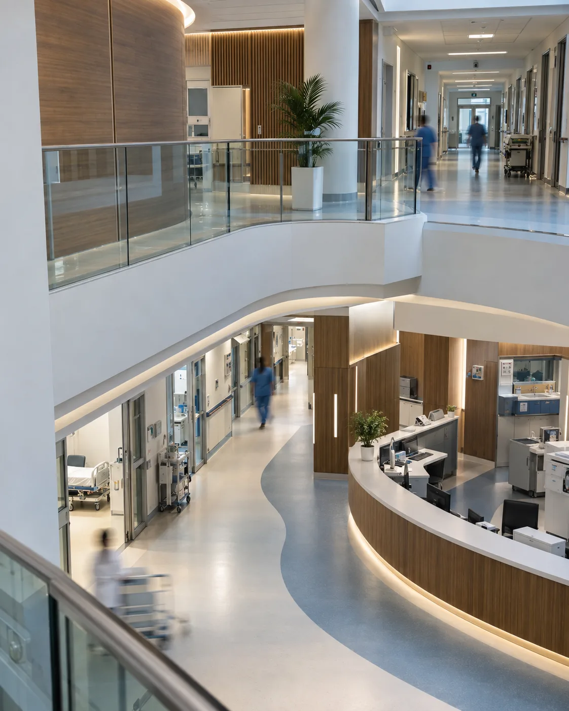 Upper-level view of intersecting corridors in a contemporary hospital