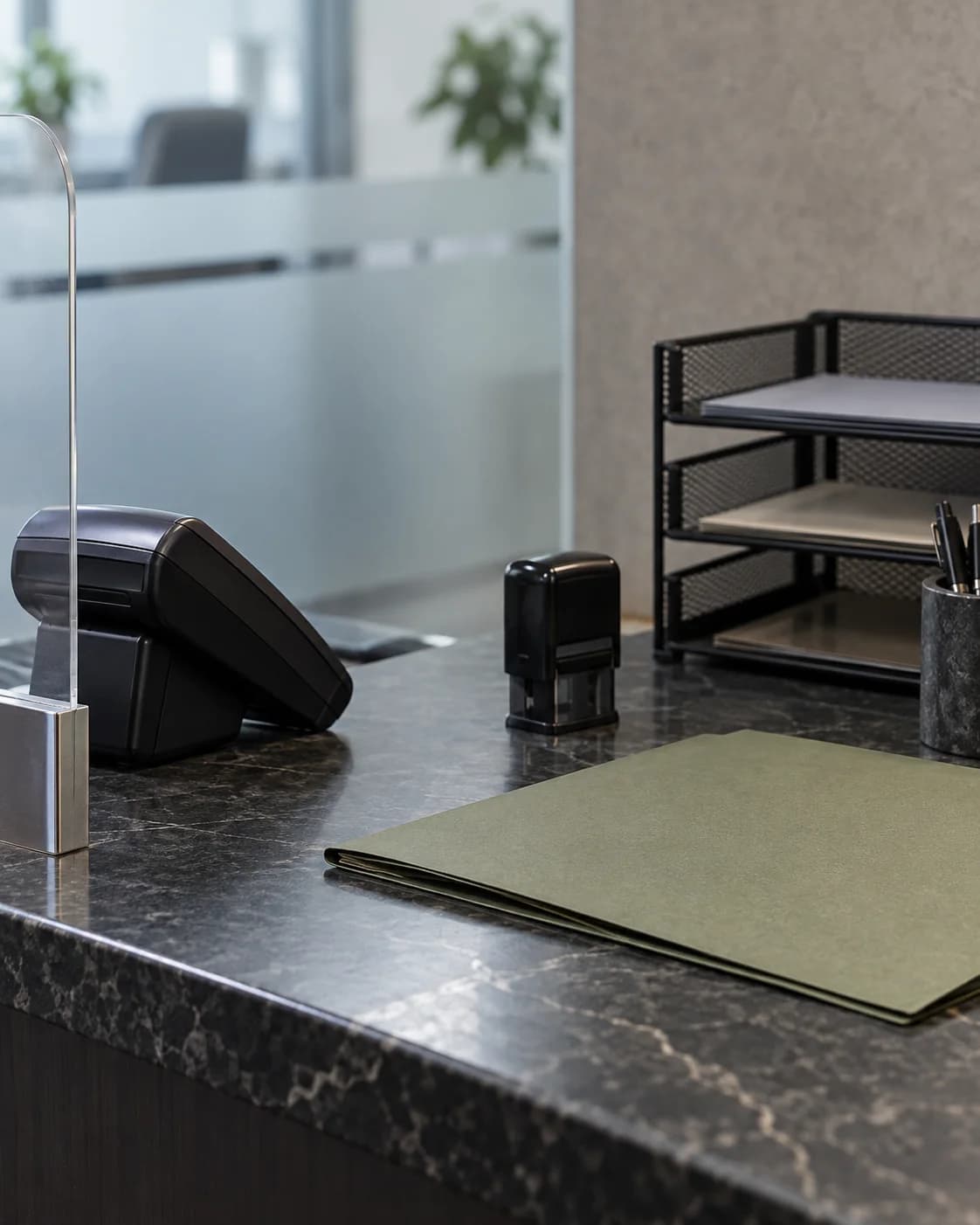 Payment terminal, blank folder, and document trays in a billing office